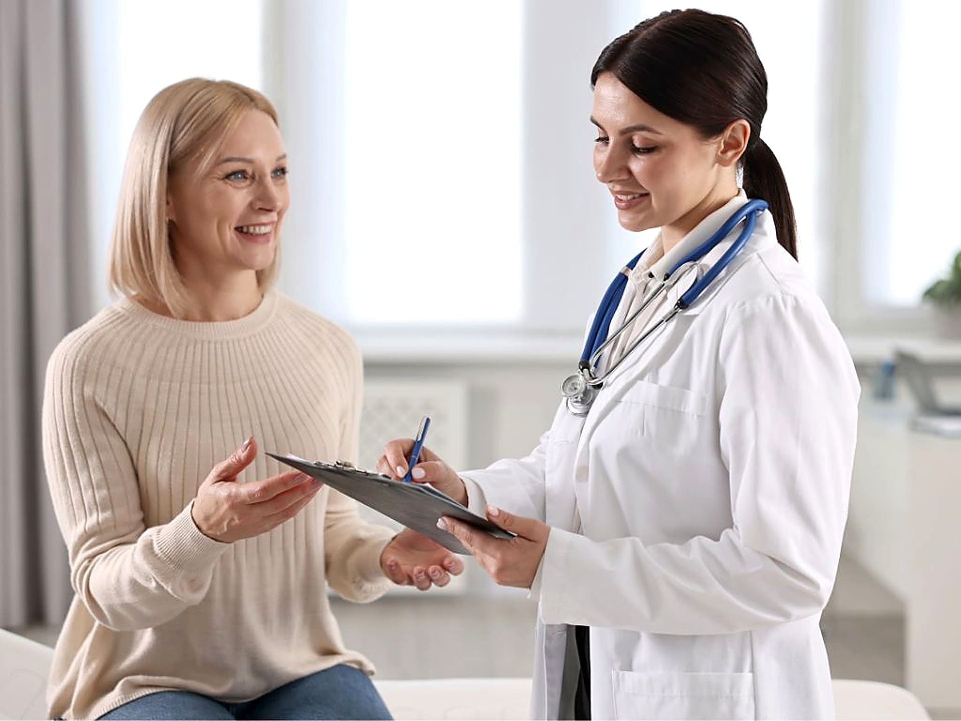 Dermatologist discussing a personalised facial injectable treatment plan with a patient